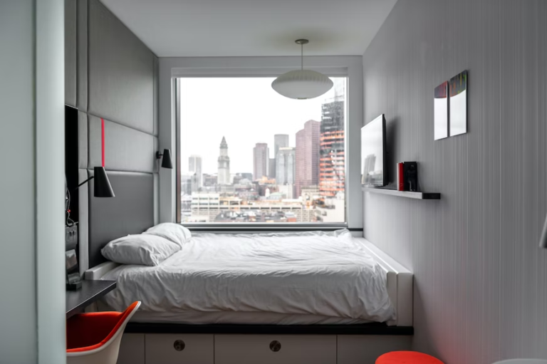bedroom with a view of the city