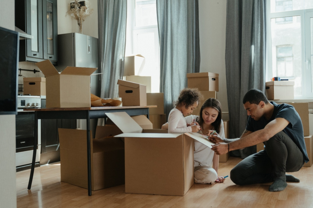 A family unpacking boxes