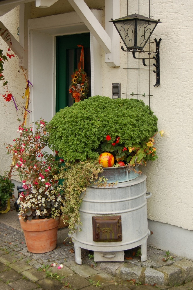A flower pot outside a house